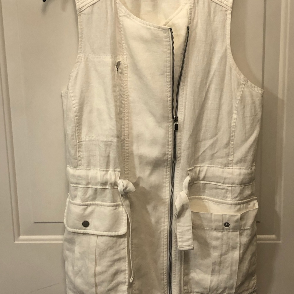 White vest with tie waist belt and many pockets